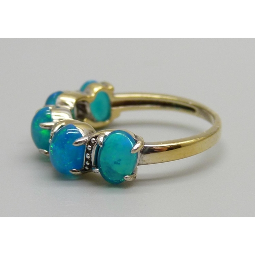 936 - A silver gilt, five stone opal ring, L