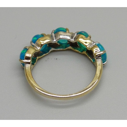 936 - A silver gilt, five stone opal ring, L