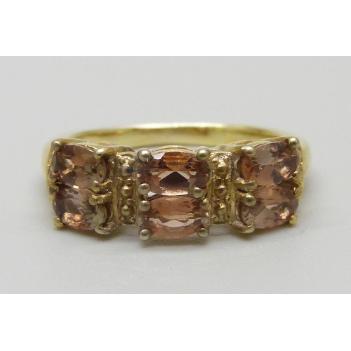 943 - A silver gilt, Brazilian Andalusite six stone ring, O, with certificate