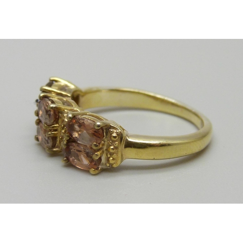 943 - A silver gilt, Brazilian Andalusite six stone ring, O, with certificate