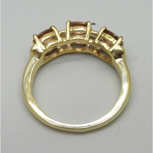 943 - A silver gilt, Brazilian Andalusite six stone ring, O, with certificate