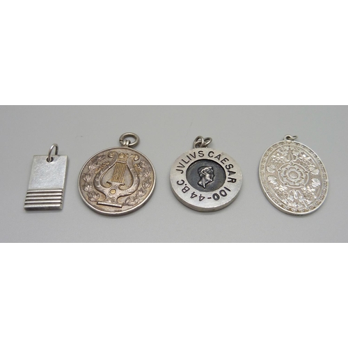 950 - Four silver medallions/pendants, 62g