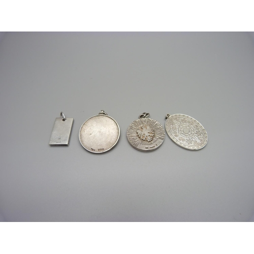 950 - Four silver medallions/pendants, 62g