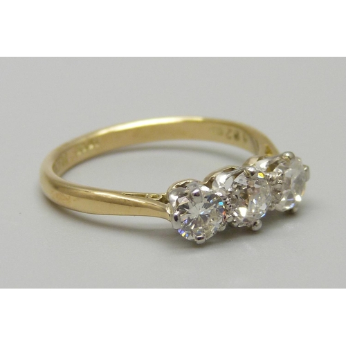 972 - An 18ct gold and platinum set three stone diamond ring, total diamond weight 0.8ct, 2.9g, N