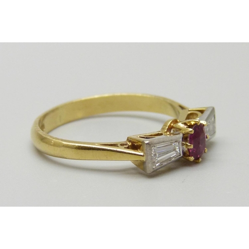 975 - An 18ct gold, ruby and trapeze cut diamond ring, Birmingham 1982, 3.2g, O