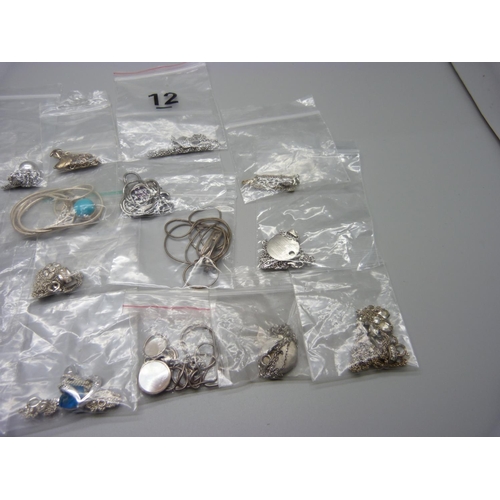 979 - Twenty silver pendants on chains