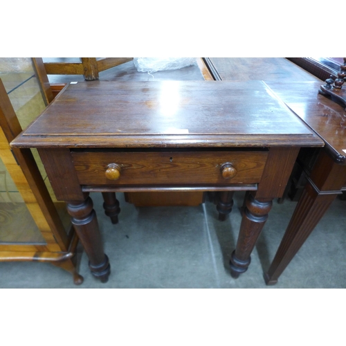 100 - A Victorian pine single drawer side table