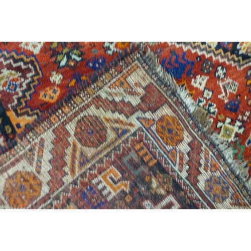 119 - An eastern red ground rug, 270 x 175cms