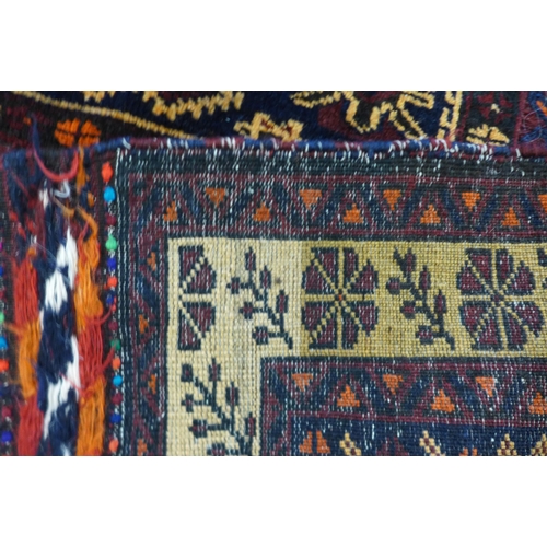 120 - A Persian Belouch Nomadic handmade rug, 86cms x 141cms