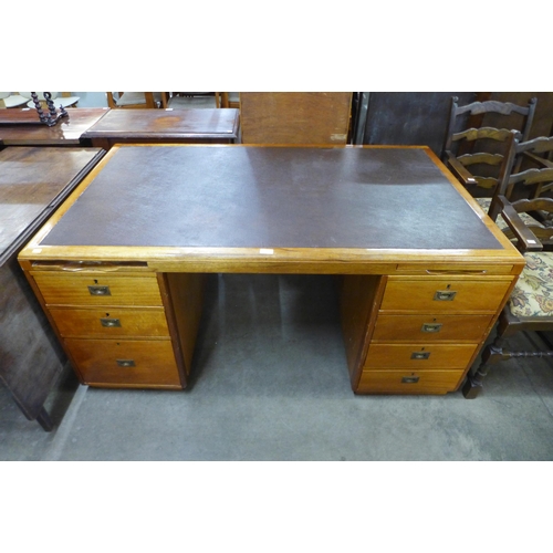 130 - A mahogany and leather topped desk