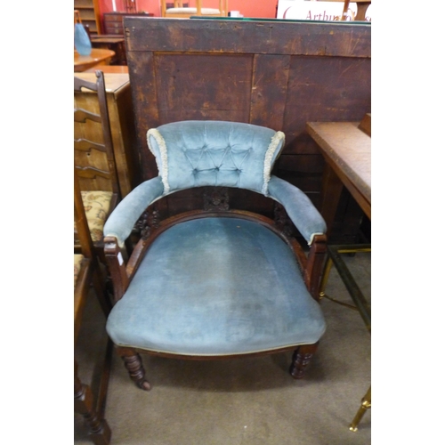 132 - A Victorian carved mahogany and upholstered tub chair