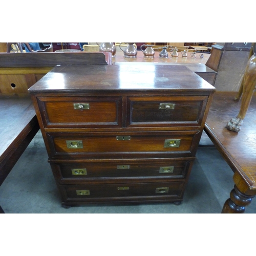 139 - A campaign style teak and brass mounted chest of drawers