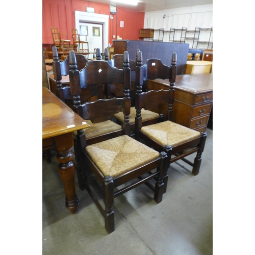 143 - A set of four Dutch oak rush seated chairs