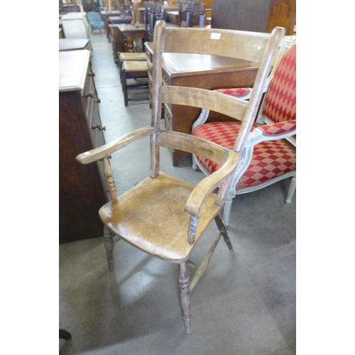 146 - A Victorian beech farmhouse armchair