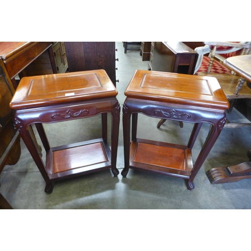 149 - A pair of Chinese hardwood lamp tables