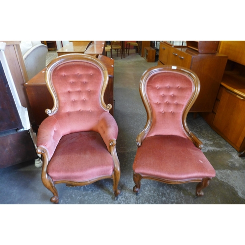 150 - A pair of Victorian lady's and gentleman's mahogany and upholstered spoonback armchairs