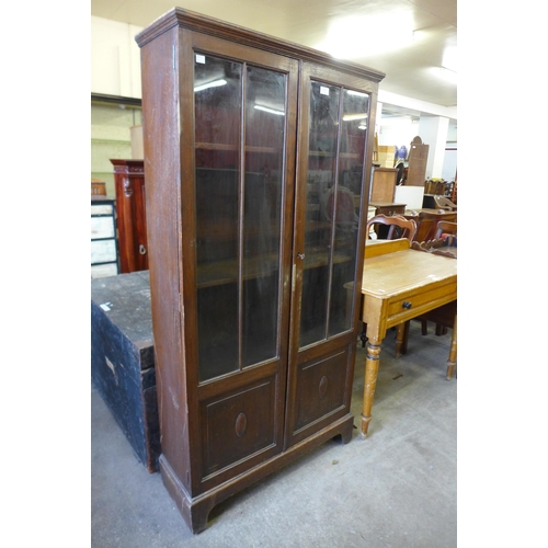 151 - An oak two door bookcase