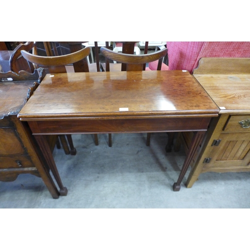 154 - A Victorian walnut fold over games table