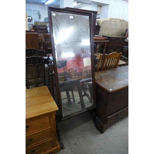 160 - An oak cheval mirror