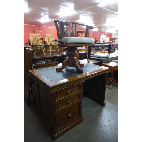 169 - A softwood desk and a matching office chair