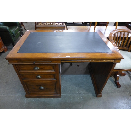 169 - A softwood desk and a matching office chair