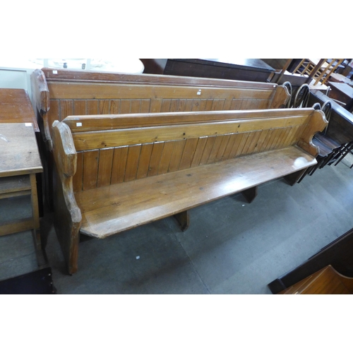 173 - A pair of Victorian pine church pews