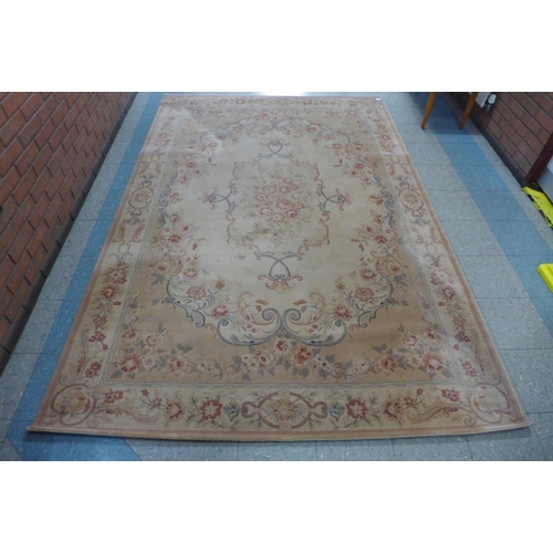 174 - A cream ground rug by Handmade Carpets Ltd. of London, 297 x 200cms