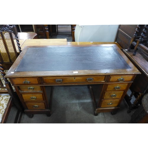 179 - A mahogany and leather topped pedestal desk