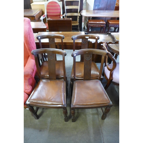 186 - A set of four oak dining chairs