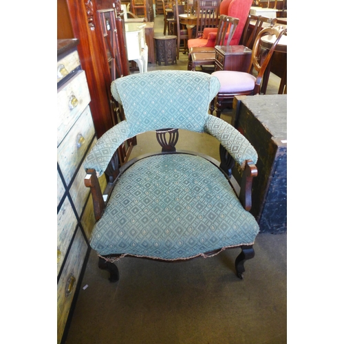 188 - A Victorian carved mahogany and upholstered tub chair