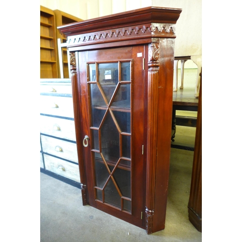 193 - A mahogany corner cabinet