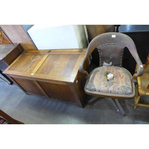 197 - An oak blanket box and a Victorian oak revolving desk chair