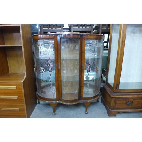 204 - An Art Deco walnut two door display cabinet