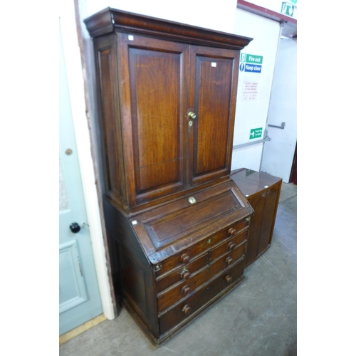 212 - A George II oak bureau bookcase