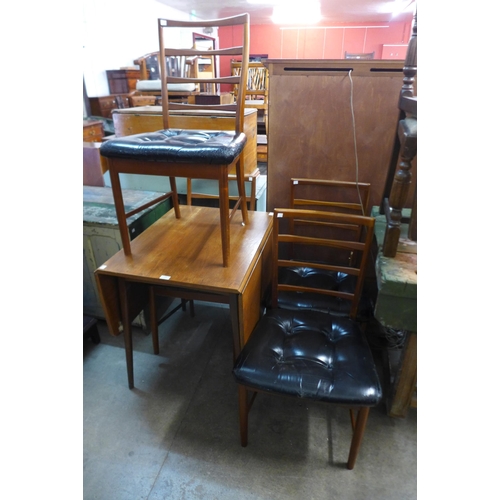 216 - A teak drop-leaf table and four chairs