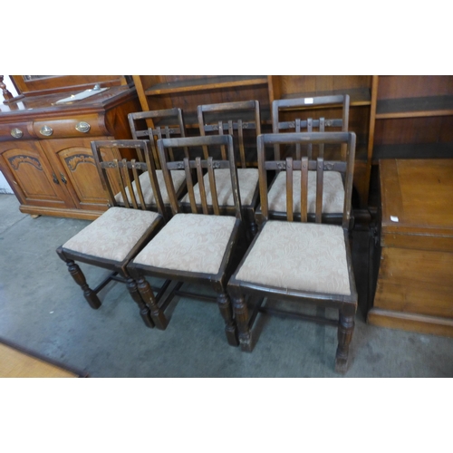 217 - A set of six oak dining chairs