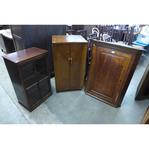 228 - A H.M.V. walnut stereogram cabinet, oak hanging corner cupboard and a small mahogany bookcase