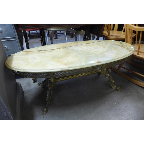 235 - A brass and onyx oval coffee table