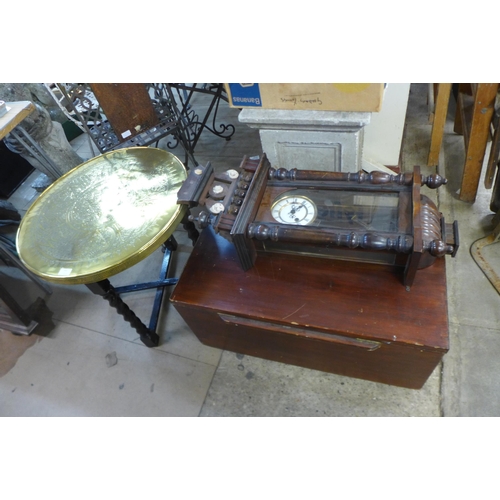 243 - An eastern brass topped folding occasional table, stained pine box and a mahogany Vienna wall clock