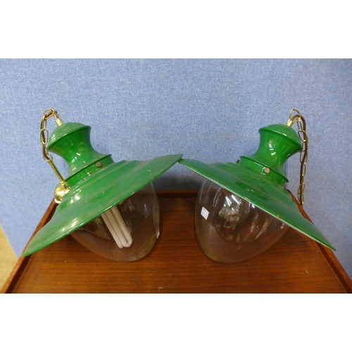 245 - A pair of industrial enamelled and glass hanging ceiling lights