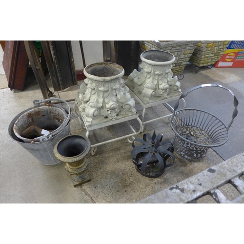 254 - A pair of wrought iron based garden planters, two galvanised buckets, small brass urn, etc.