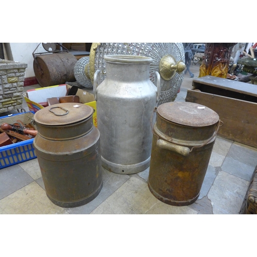 257 - A steel milk churn and two lidded tins