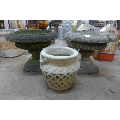 272 - A pair of concrete planters on stand and one other