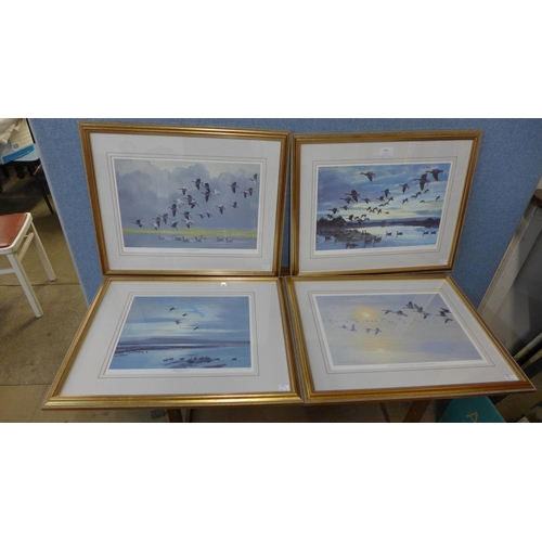 305 - A set of four Peter Scott limited edition prints, Mallards at Dawn, Pinkfeet Coming in from the Solw... 