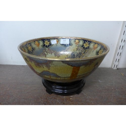 312 - An oriental painted porcelain bowl on ebonised stand