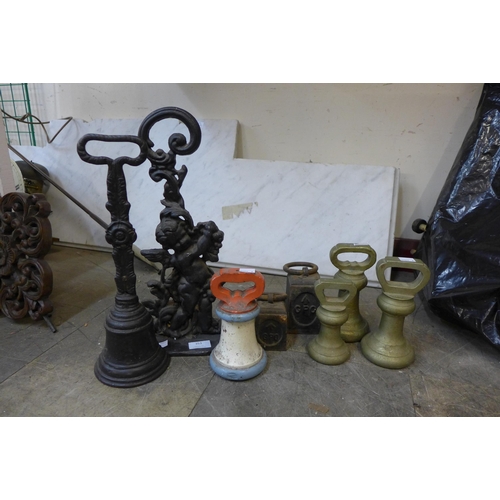 353 - Assorted brass and cast iron weights and door stops