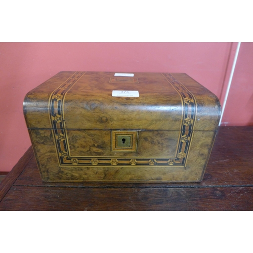 373 - A Victorian inlaid walnut lady's sewing box