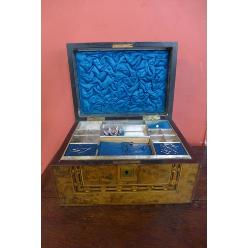 373 - A Victorian inlaid walnut lady's sewing box