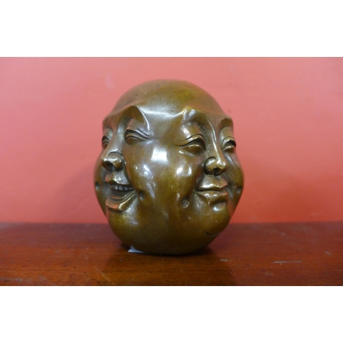 376 - A small oriental bronze four faced Buddha