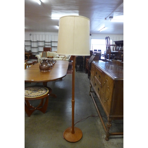 39 - A teak standard lamp